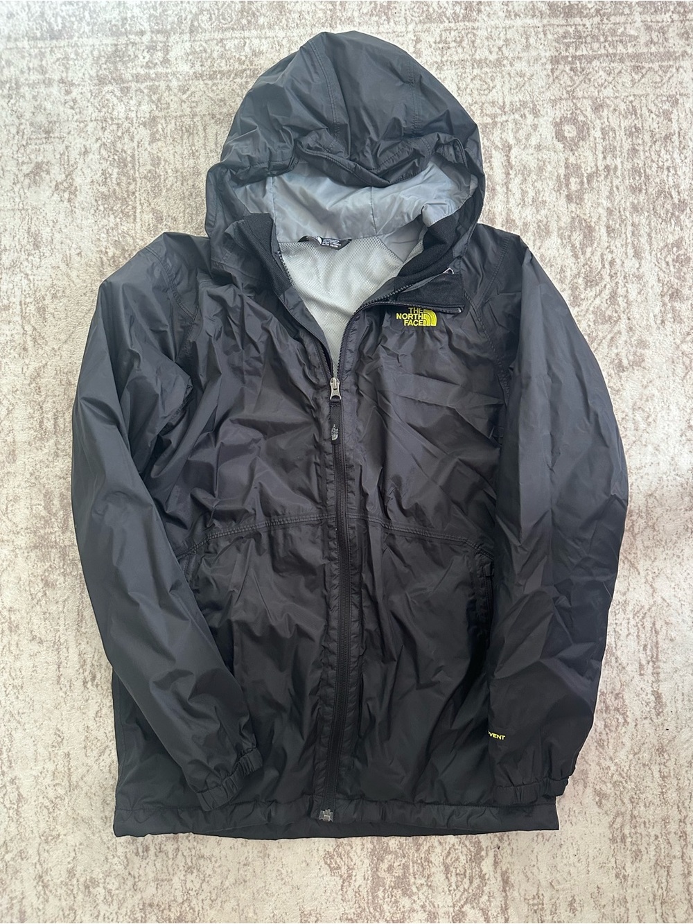 The North Face Kids Black Hooded Rain Jacket with Yellow Logo